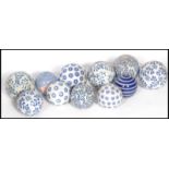 A group of twelve mid century blue and white ceramic carpet bowls of varying designs and patterns.