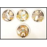 A set of four Royal Doulton Behind The Painted Masque Convex wall plaque plates to include Make Me