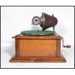 A vintage early 20th century rare table top Gramophone by Nirona. The tin soundbox and horn system