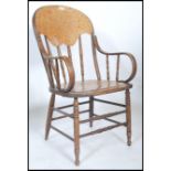 A Victorian bentwood panel back office desk chair - armchair being raised on turned legs with