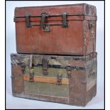 Two vintage early 20th century steamer trunks to include a canvas and wooden bound military trunk