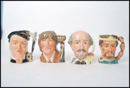 A group of four Royal Doulton character jugs to include Romeo D6670 Macbeth D6677 Hamlet D6672 and
