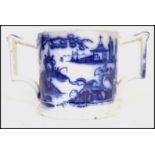 A 19th century Chinese blue and white hand painted porcelain twin handled loving cup having shaped