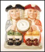 A Royal Doulton double Toby jug Celsius and Fahrenheit D7143 limited edition 305/2500 in box.