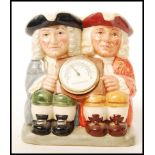 A Royal Doulton double Toby jug Celsius and Fahrenheit D7143 limited edition 305/2500 in box.