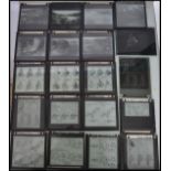 A collection of vintage 20th century glass plate slides held within vintage Kodak boxes. Mostly