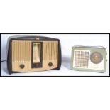 A vintage mid 20th century transistor radio by Decca together with another vintage bakelite radio by