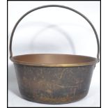A late 19th century Victorian copper and brass cast handle jam / preserve pan. The handle fitted