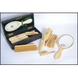 A collection of late 19th / early 20th century Ivory and Ivorine ladies hand held dressing table