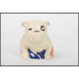 A Royal Doulton figurine depicting a Winston Churchill British bulldog drapped in the Union flag