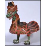A 20th century Indian wooden sculpted and carved depiction of a chicken being hand painted with