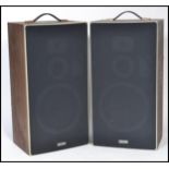 A vintage retro 20th century pair of teak cased Solavox speakers with carry handles atop. 53x28x21.5