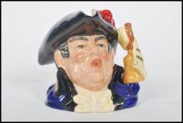 A rare Royal Doulton character jug depicting a town crier D6895 , handle modelled on a town crier'