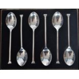 A boxed set of six silver hallmarked seal top spoons within the original fitted case with silk and