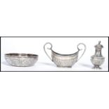 Two silver hallmarked condiments along with an Islamic silver bowl. Please see images. Total