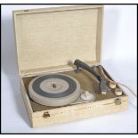 A vintage retro 20th century electric record player. The portable record deck housed within a