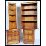 Ercol - Mural -  An unusual elm upright cupboard having a wide top and bookcase above with angled