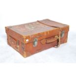 A vintage 20th century leather gentleman's suitcase having leather straps and buckles.