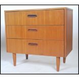 A vintage retro 20th century Danish inspire teak chest of drawers. The bank of drawers having