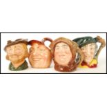 A group of four Royal Doulton character jugs to include Pied Piper and Robin Hood , Friar Tuck and