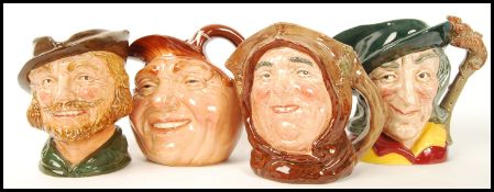 A group of four Royal Doulton character jugs to include Pied Piper and Robin Hood , Friar Tuck and