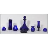 A collection of 20th century Bristol Blue glass items to include a ships decanter, 2 hearts, 2