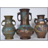 A group of three 20th century Chinese cloisonne vases having mythical creature handles. Highest