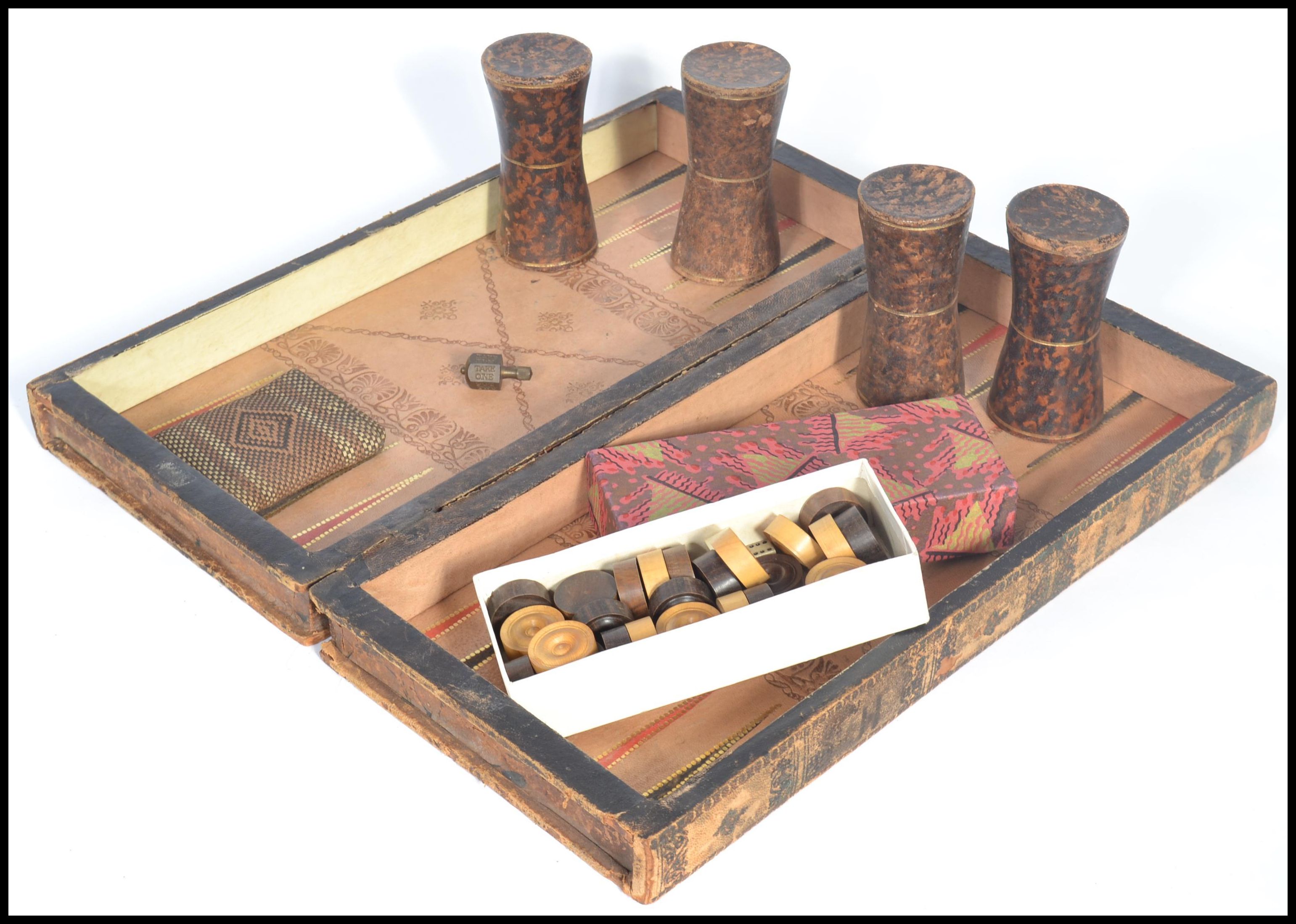 An early 20th century chess board games compendium set containing a draughts set , dice shakers.