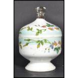 A 19th century Victorian lidded pot and cover. The faceted glass finial atop a hand painted lid with