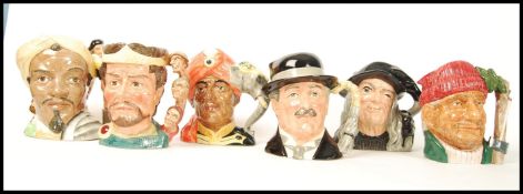 A group of six Royal Doulton character jugs to include The Witch D6893 , The Lumberjack D6610 , City