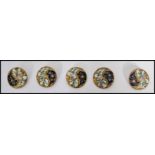 A set of five 19th century enamel and hand painted buttons, each button decorated with hand
