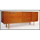 A mid century retro teak wood sideboard by Avalon, central bank of three drawers flanked by