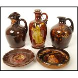 A good collection of Royal Doulton kingsware liqueur flasks to include the pied piper liquer flask
