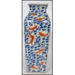 A 20th century Chinese vase on blue ground decorated with carp. The vase of tall square form with