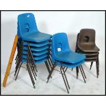 A set of  6 retro 1970's blue plastic and tubular metal stacking chairs. Raised on ebonised