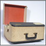 A vintage 20th century Ferguson four speed portable record player, the two tone case fitted with a