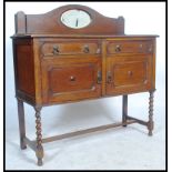 A 1920's oak barleytwist / barley twist mirror back sideboard dresser base. Raised on barley twist