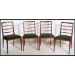 A set of four retro 20th century / 1970's teak wood rail back dining chairs having  vinyl seat