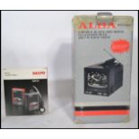 A retro boxed possibly unused new old stock Alba portable television and radio combi together with a