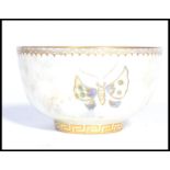 A vintage 20th century Wedgwood butterfly lustre bowl, with orange interior and opalene exterior,