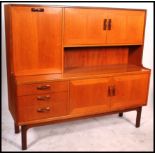 A vintage / retro G plan teak high board / sideboard from the Sienna range enclosed by an
