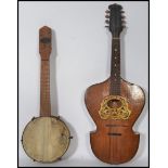 A vintage 20th century Broadway Banjolele musical instrument along with a 19th century believed