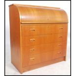 A retro / vintage Danish influence teak wood cylinder bureau, having a fully appointed interior over