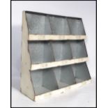 A vintage 20th century retro industrial galvanised nine section office file pigeon hole wall hanging