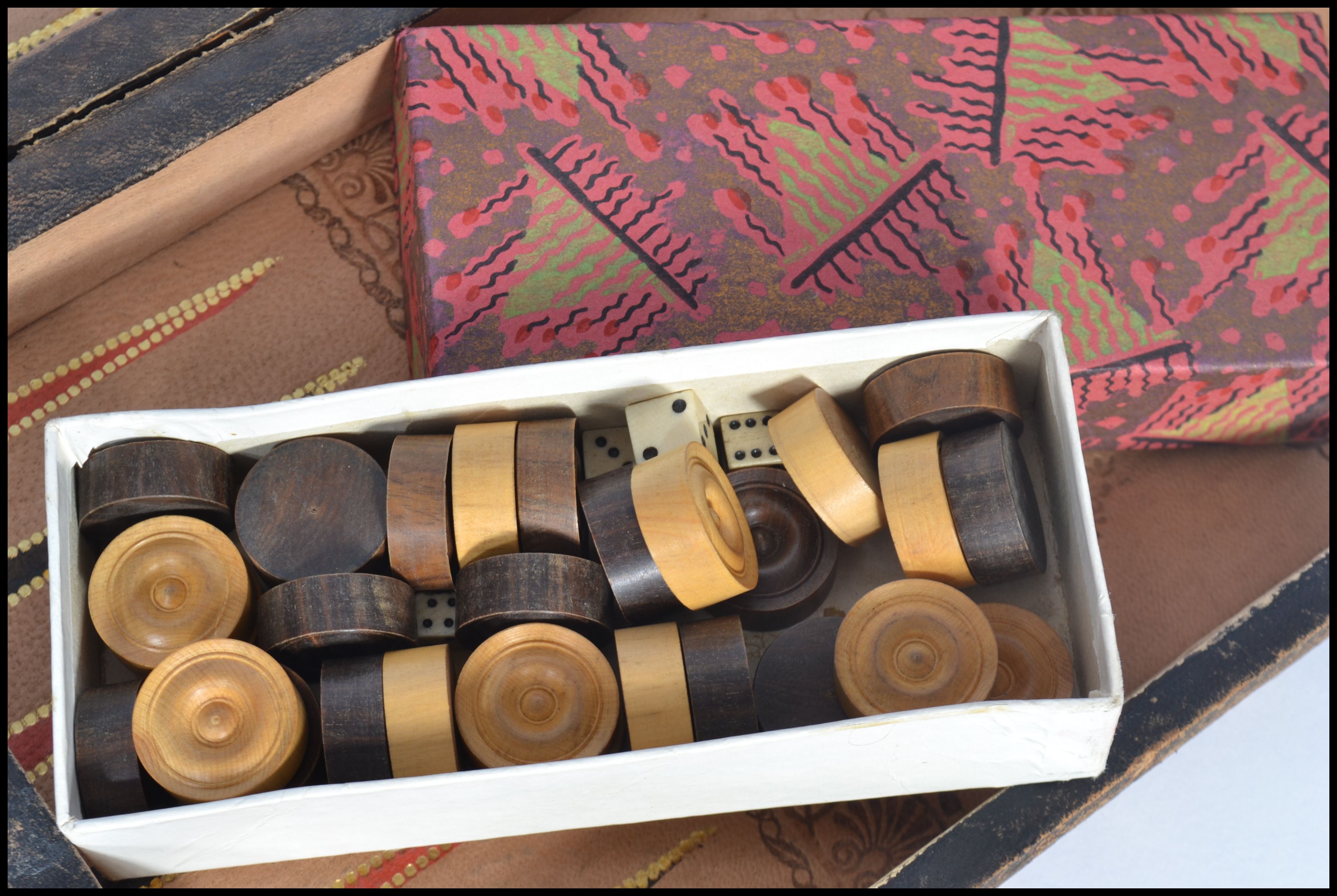 An early 20th century chess board games compendium set containing a draughts set , dice shakers. - Image 2 of 3