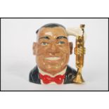 A rare Royal Doulton character jug depicting Louis Armstrong D6707 , handle modelled on a a gilt