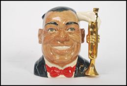 A rare Royal Doulton character jug depicting Louis Armstrong D6707 , handle modelled on a a gilt