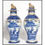 A pair of 19th century English pearlware pearl ware blue and white Oriental Chinese style vases