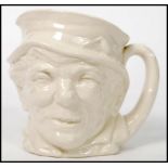 An unusual Royal Doulton Paddy character jugs in plain white. Unpainted with green Doulton stamp