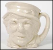 An unusual Royal Doulton Paddy character jugs in plain white. Unpainted with green Doulton stamp